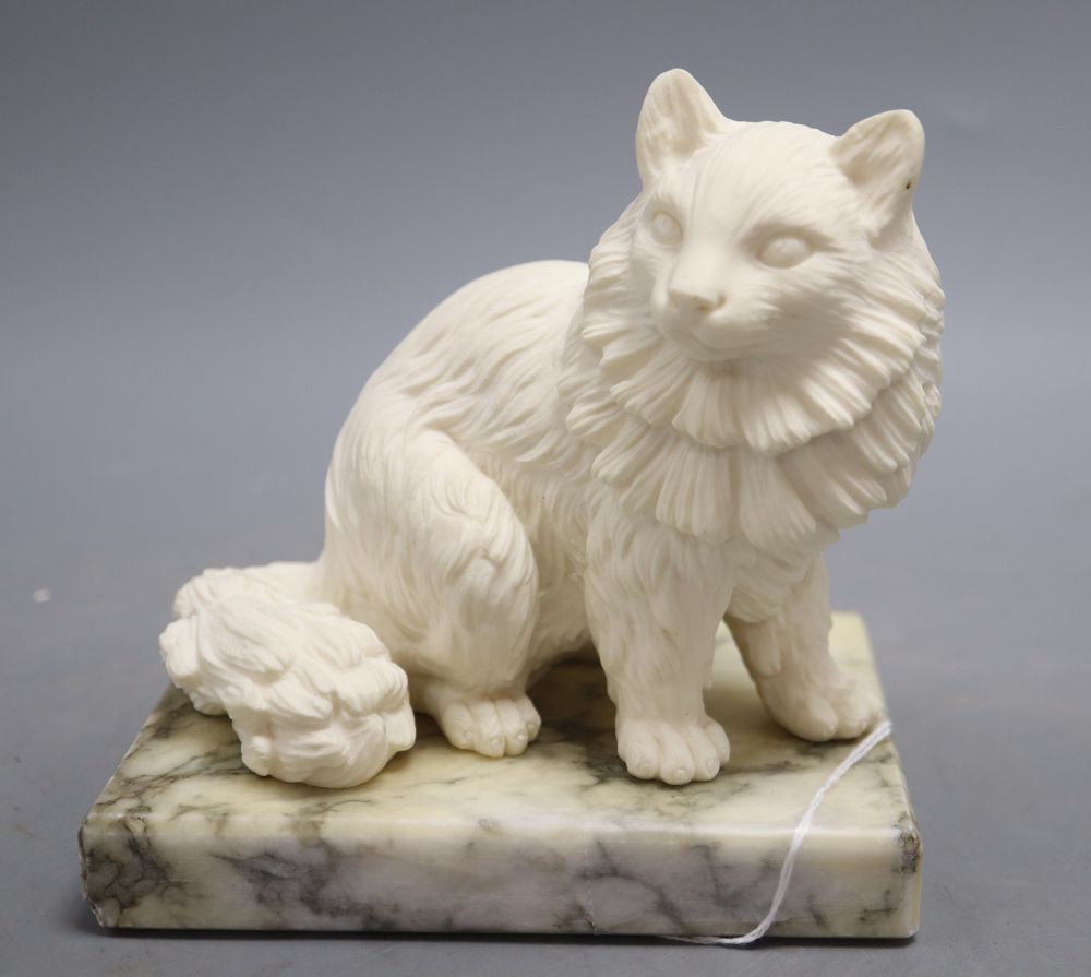 A model of a cat on marble stand, signed A.Genarelli, height 14cm